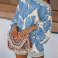 Off-shoulder blue leaf romper