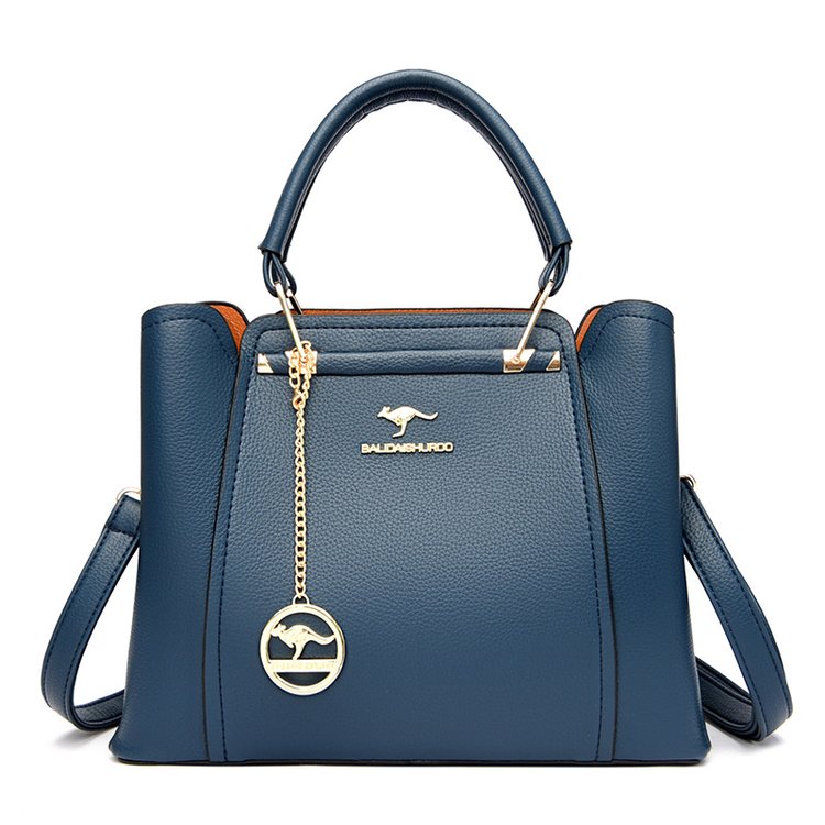 Gold tone charm handbag