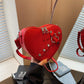 Red heart shaped shoulder bag