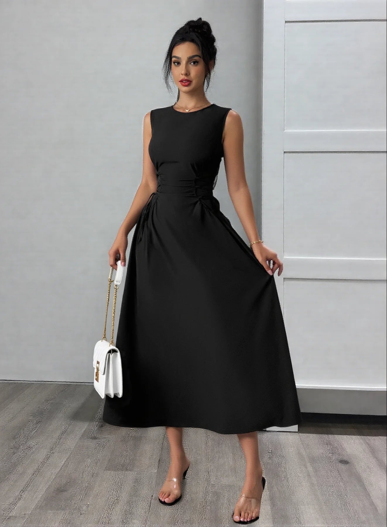 Black sleeveless ruched midi dress