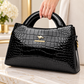 Black crocodile embossed handbag