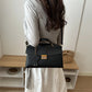 Gold clasp structured handbag