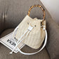 Adjustable strap straw bag
