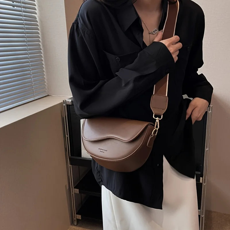 Curved flap shoulder bag