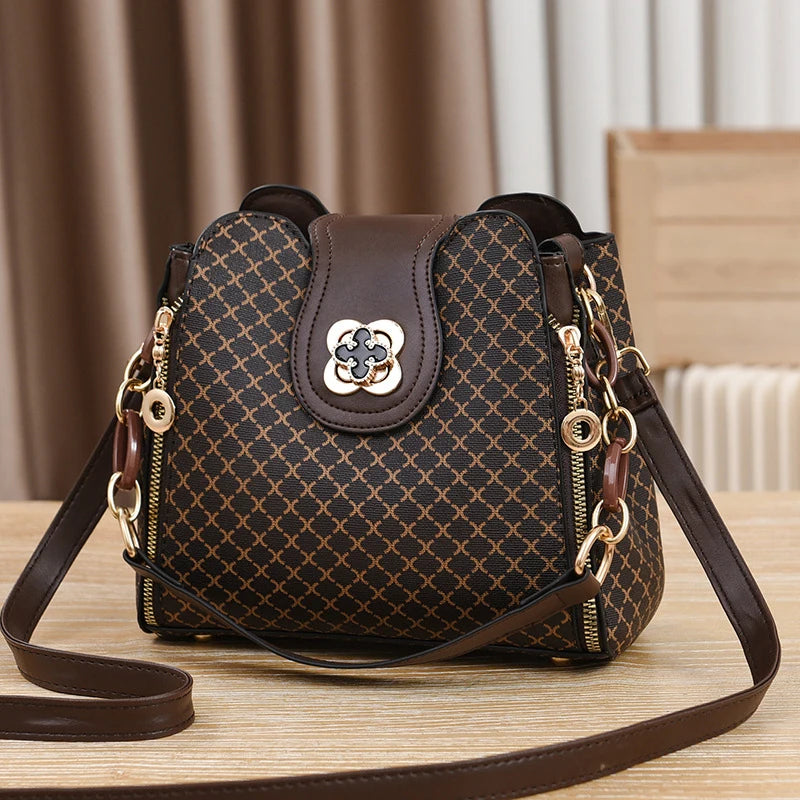 Patterned flap closure crossbody bag