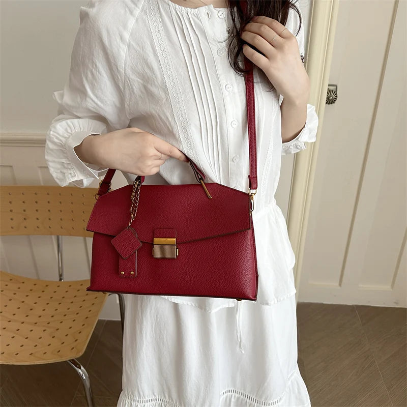 Red structured top handle handbag