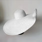 white oversized floppy beach hat