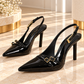 Glossy black pointed toe pumps