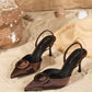 Brown oval buckle heels
