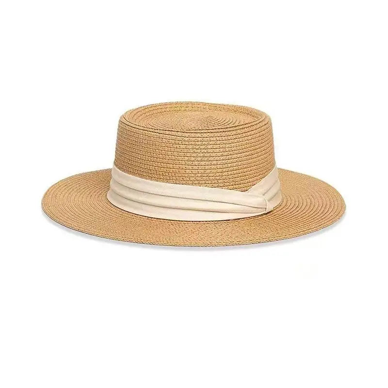 Flat crown straw hat with white ribbon