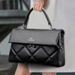Quilted leather satchel handbag